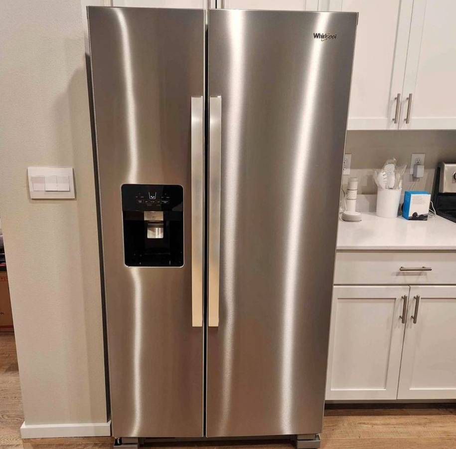 Whirlpool side by side refrigerator. Finger print resistant stainless steel finish.