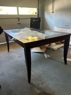 Deep brown wooded Table with glass