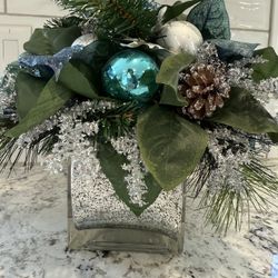 Winter/Holiday centerpiece/floral arrangement with ornaments and silk flowers