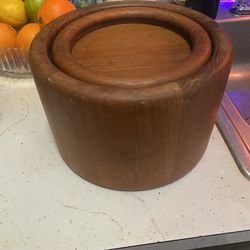 Richard Nissen  A solid teak ice bucket with grey plast lining  teak