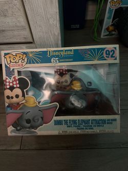 Disneyland dumbo the flying elephant attraction with minnie mouse funko pop