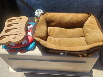Dog bed with toys