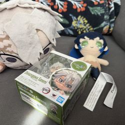Demon Slayer Plushie And A Collectible Figure 