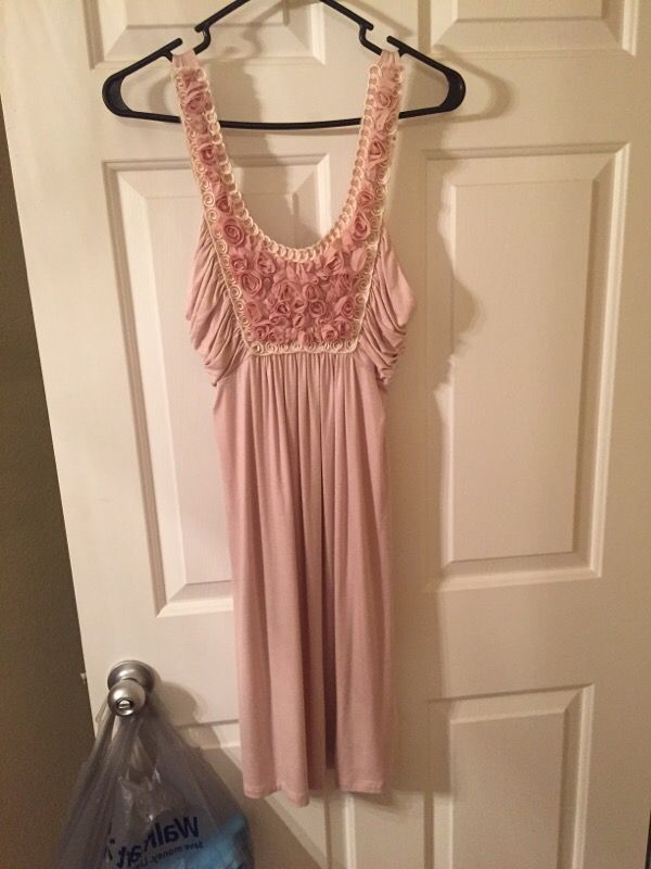 Dress. Size medium. Never worn. Pink with flower details