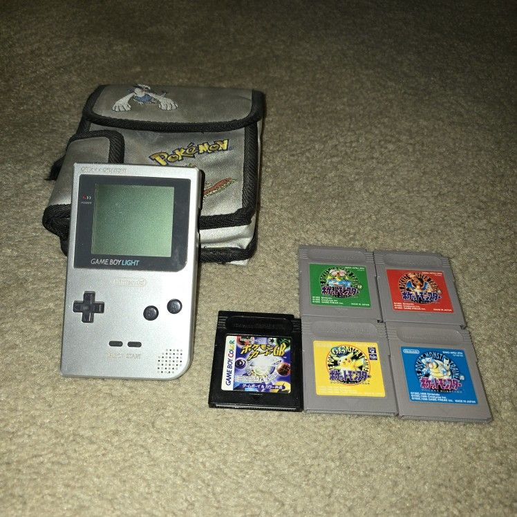 Gameboy Light with all OG Pokémon games.