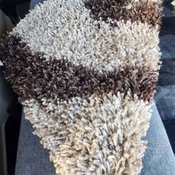 8'x10' thick heavy modern rug in beige/brown color.