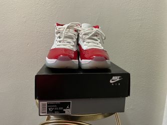 Jordon 11 Retro “Bred” sneakers in red and white, size 10.5