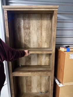 Rustic shelving unit with an oak finish