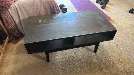 Black coffee table with glass top