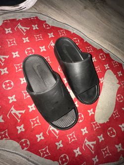 Black Nike slides