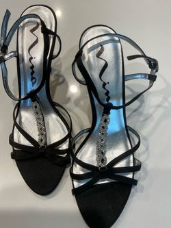 Size 10 black heels by “Nina”