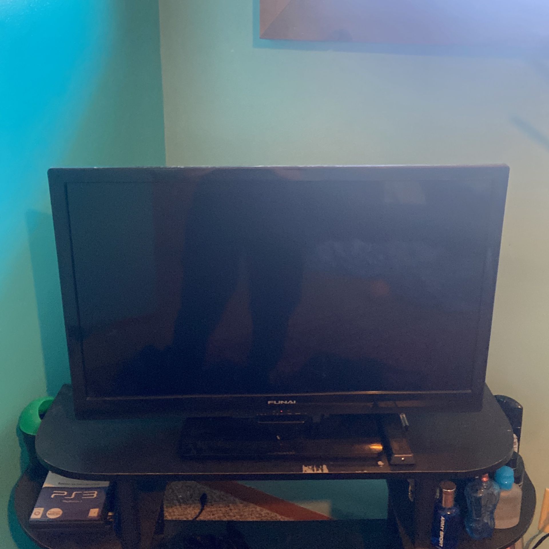 30 inch TV with power cord, HDMI cord and controller