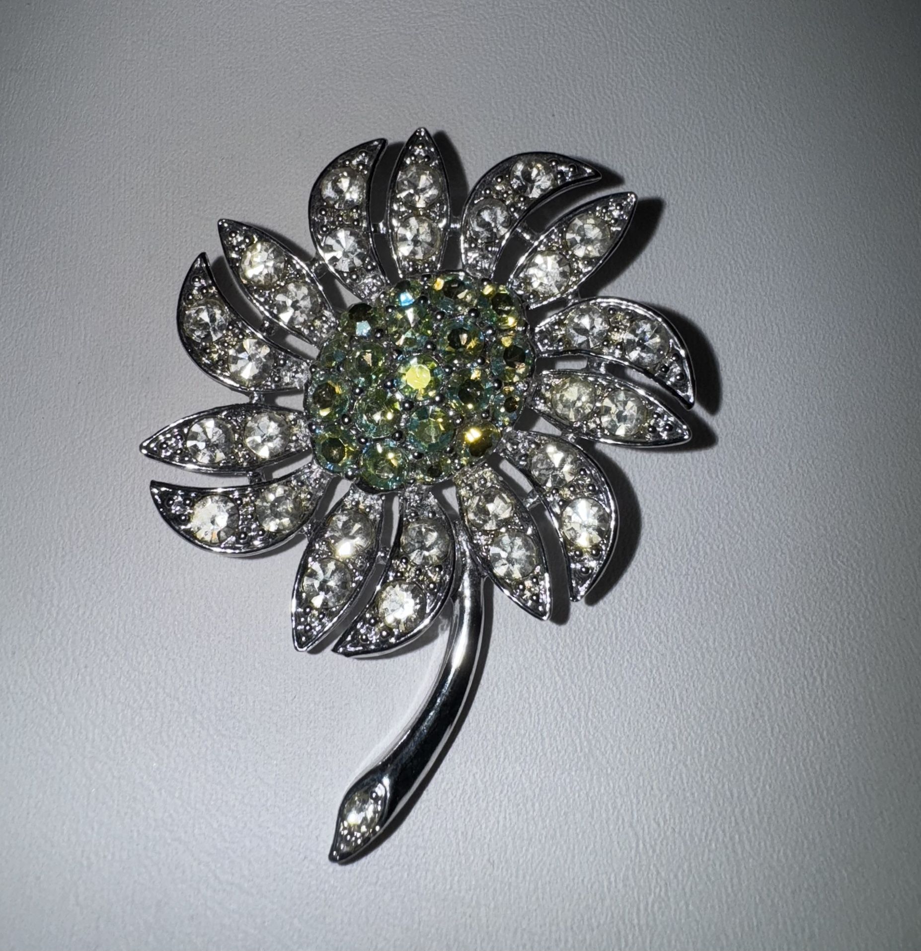 Vintage Sarah Coventry Silver Tone Flower Brooch with Green Rhinestone Center 