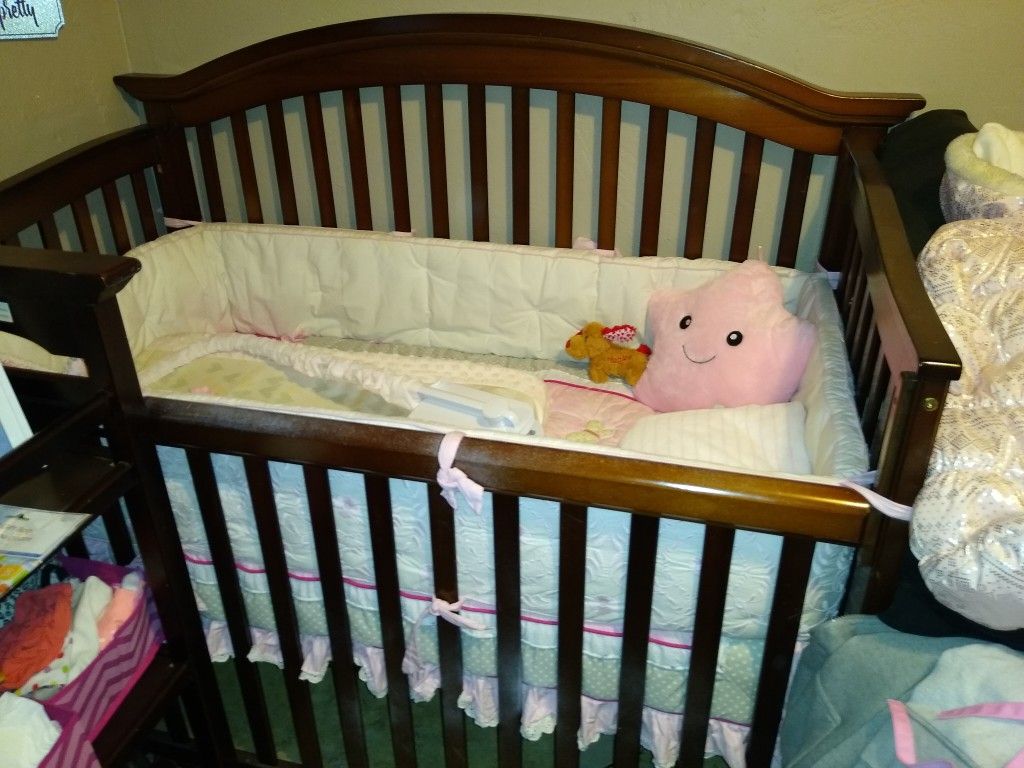 Crib mattress and changing table and pad, only$40. OBO crib, and changing table