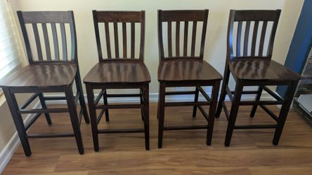 Four counter height chairs