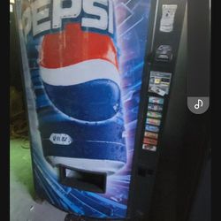 Vendo Soda Machine And Working With Coins In It.