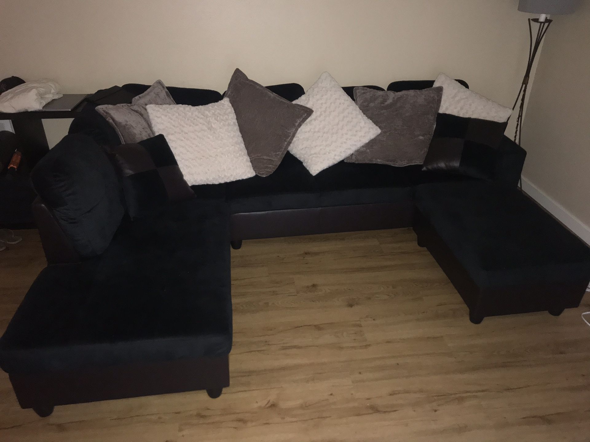 Black sectional pillows included