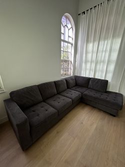 Large and comfortable gray sectional sofa with chaise for sale.