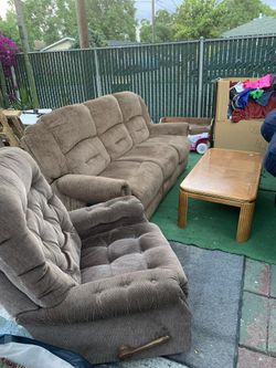 Couch set They both recline the chair also rocks come a table