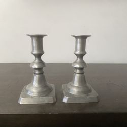 2 Pewter candlesticks.