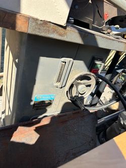 Vintage Rockwell Heavy Duty Wood Shaper is a cast iron and steel woodworking machine with a grey finish. It has a large wooden extension table and a m