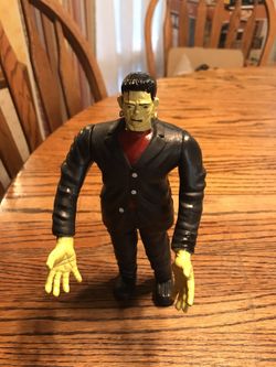 Frankenstein action figure and Frankenstein movie book vintage