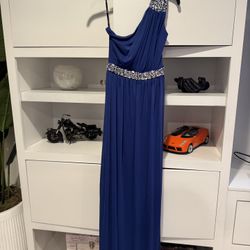 Royal blue long prom dress with silver rhinestones on the shoulders and waist. Brand new, size 5.