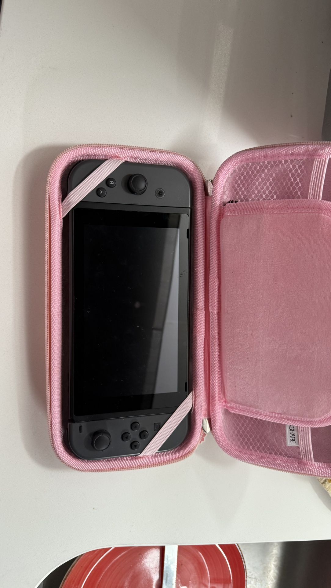 Nintendo Switch, Mario Kart Game, And Case