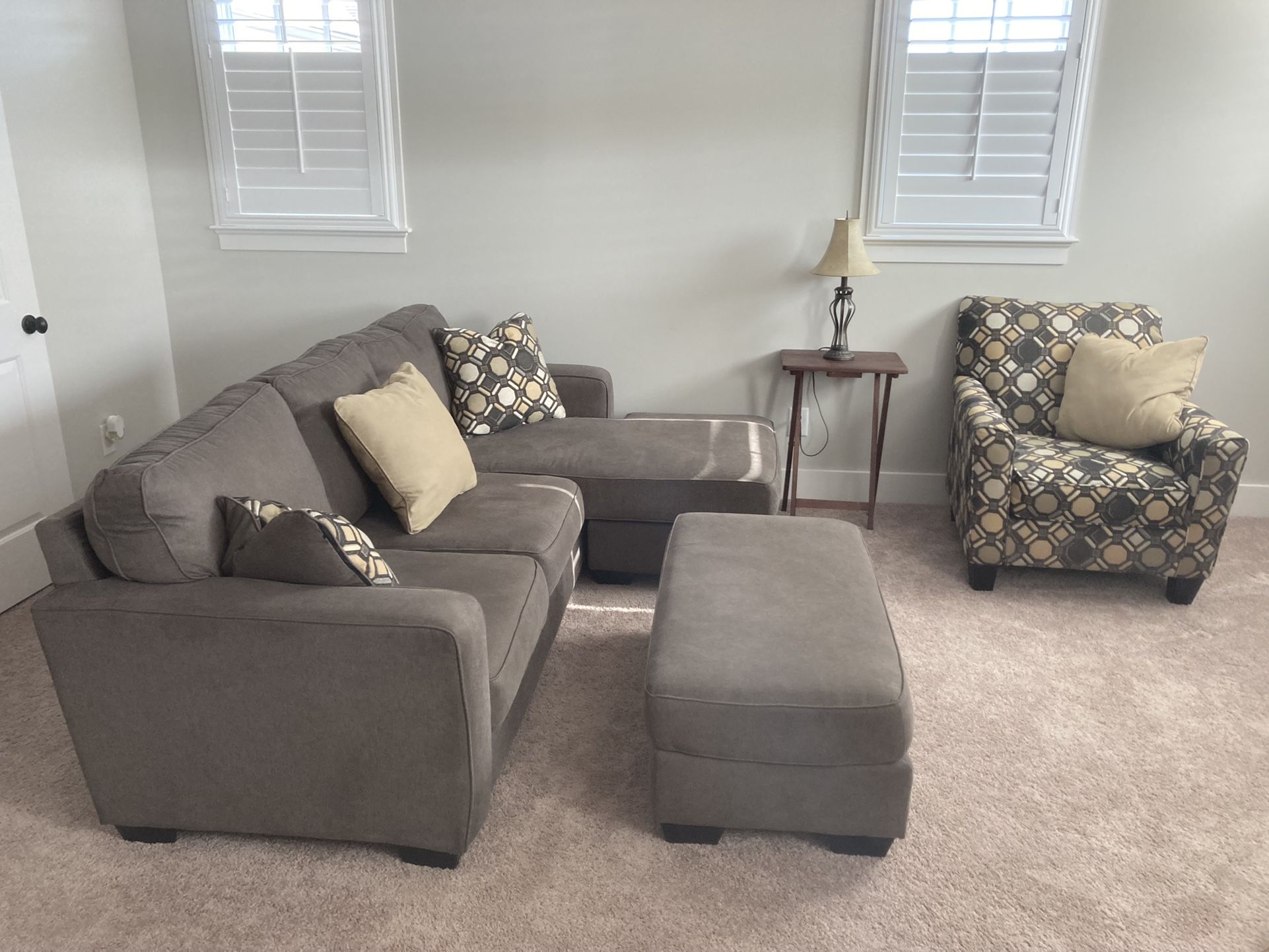 3 piece living room set from Ashley Furniture, including sectional with right or left chaise, plus ottoman, and chair
