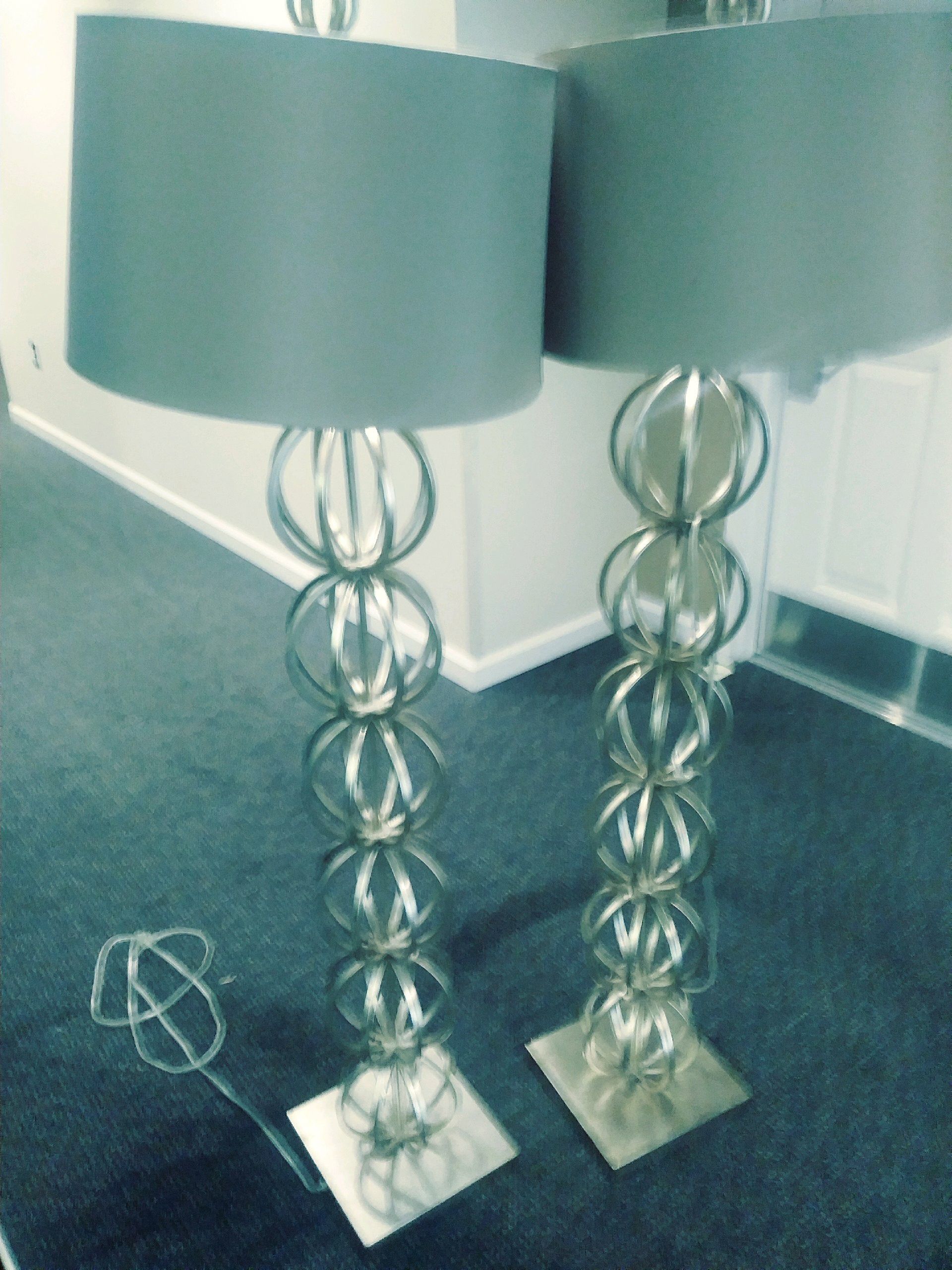 Brass floor lamps with grey shades
