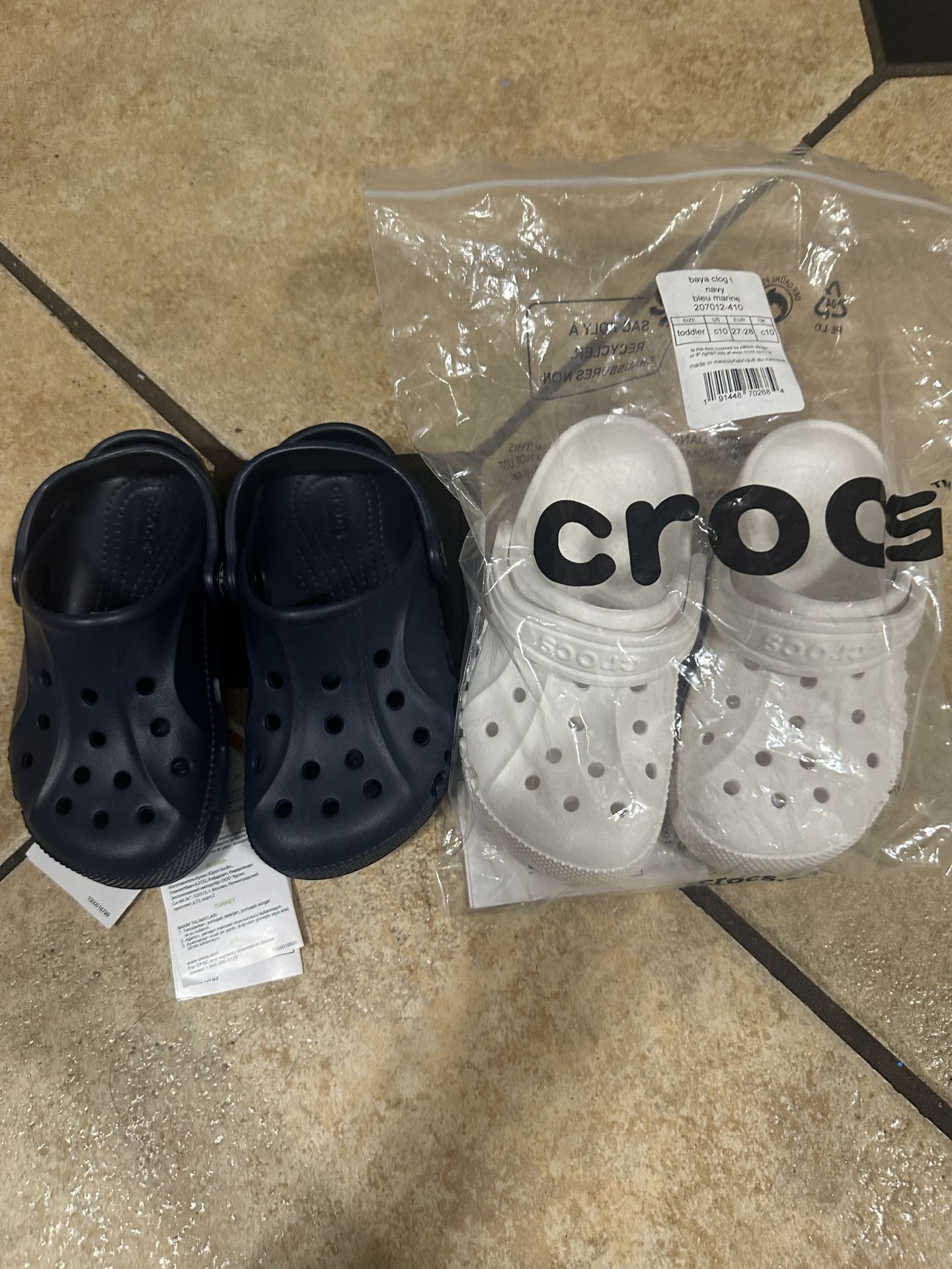 Brand New Kids Crocs Size 10c. Navy Blue And White $25 Each FIRM. Or $45 Both. Also Selling Croc Charms $1 Each