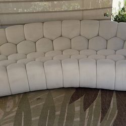 Modern curved off-white boucle sofa by lamod