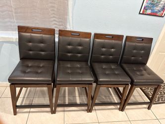 Table w/swivle chairs and a bench