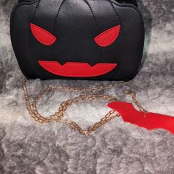 Brand new pumpkin Jack-o'-lantern cross body purse/bag.
