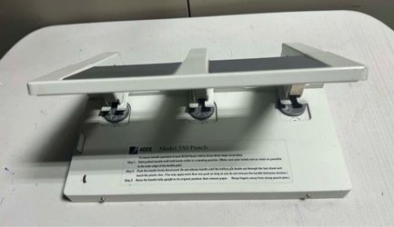 an ACCO Model 550 Heavy Duty 3-Hole Paper Punch