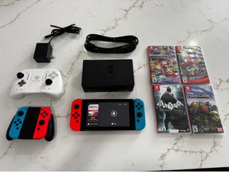 Nintendo Switch + 4 Games + Extra Joy Cons