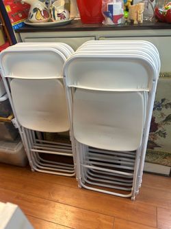 White plastic folding chairs