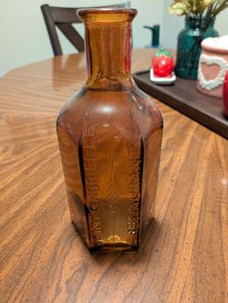Saint Gabrielle Restaurant Amber Glass Bottle