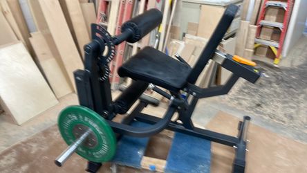 Leg extension/leg curl machine