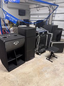 DJ Equipment Setup with Subwoofers and Mixer