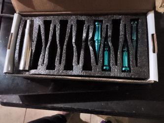 4 spiked candy teal spikes for the rims and the tool to take em on n off