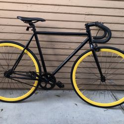 Black Fixed Gear Bike with Yellow Wheels