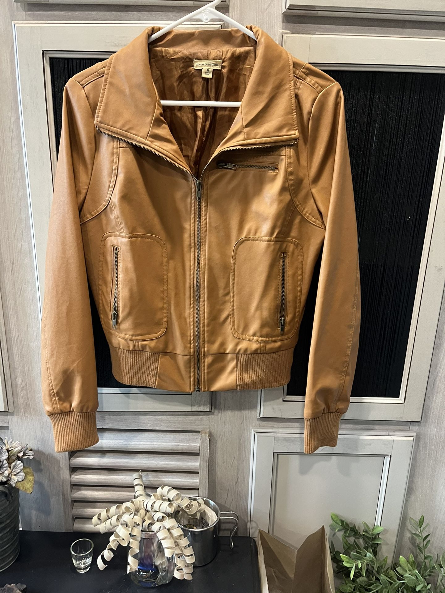 Imitation leather jacket and good condition zippers all work clean