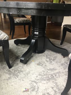 Black round table (54 inch) with 4 pottery barn chairs