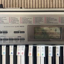 Casio / 61 Keys/  Helps  You Play Lots Of Songs/  everything works used well kept located in Hemet