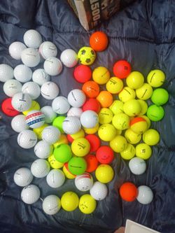 An assortment of used golf balls many brands $60 obo