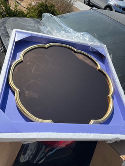 Wavy trim wall mirror