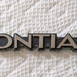 Original GM Pontiac 70's 80's Firebird GrandAm Trunk Emblem Name Plate Badge. 