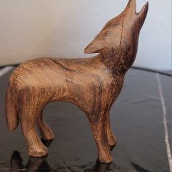 Wood Carved Wolf Howling At The Moon