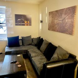 Gray L shaped modern sofa couch with black leather 